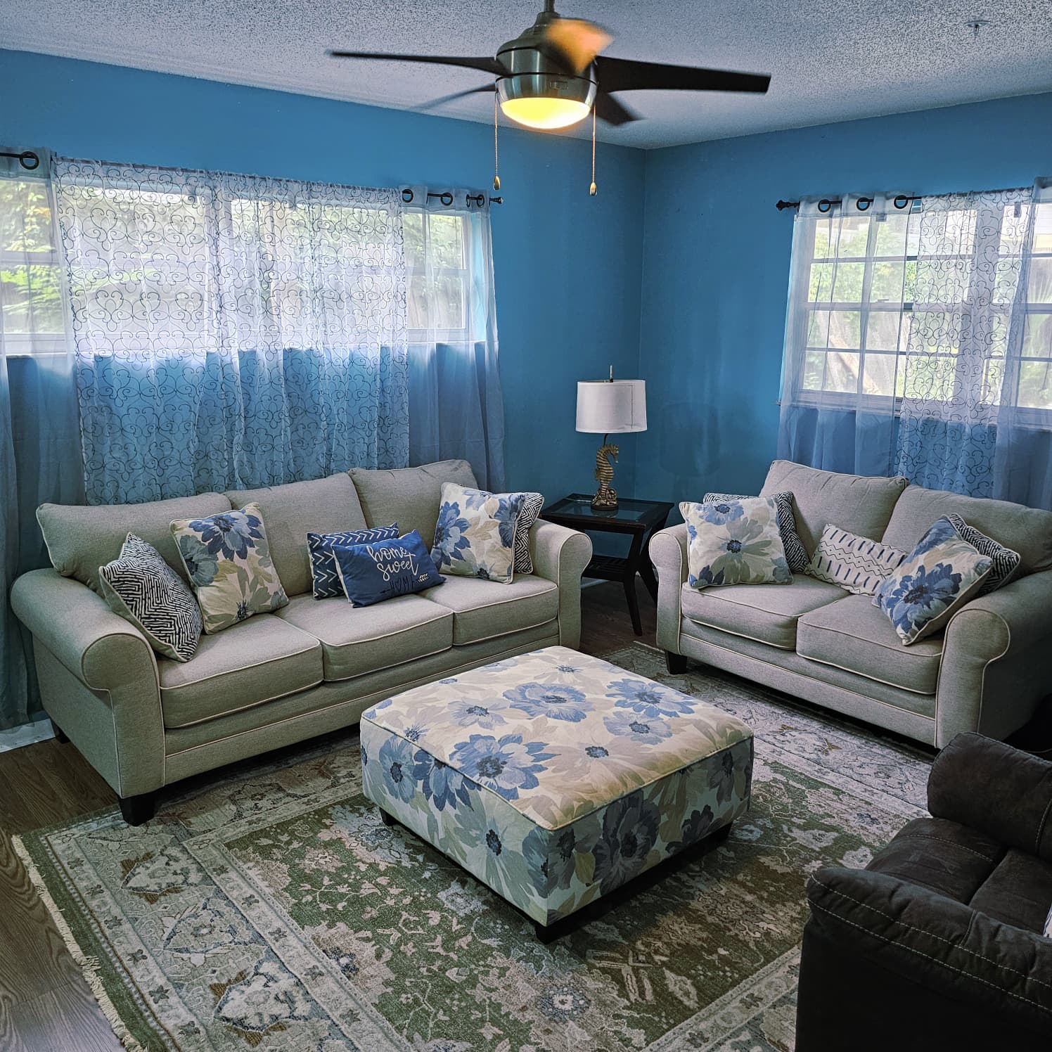 Comfortable family room with sofas and natural light