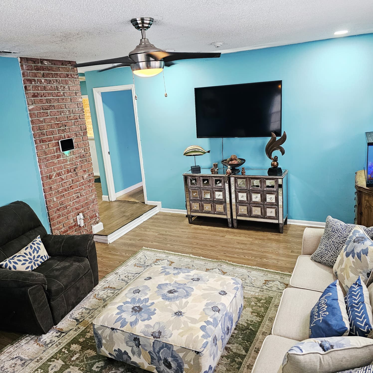 Family room with television and lounge seating